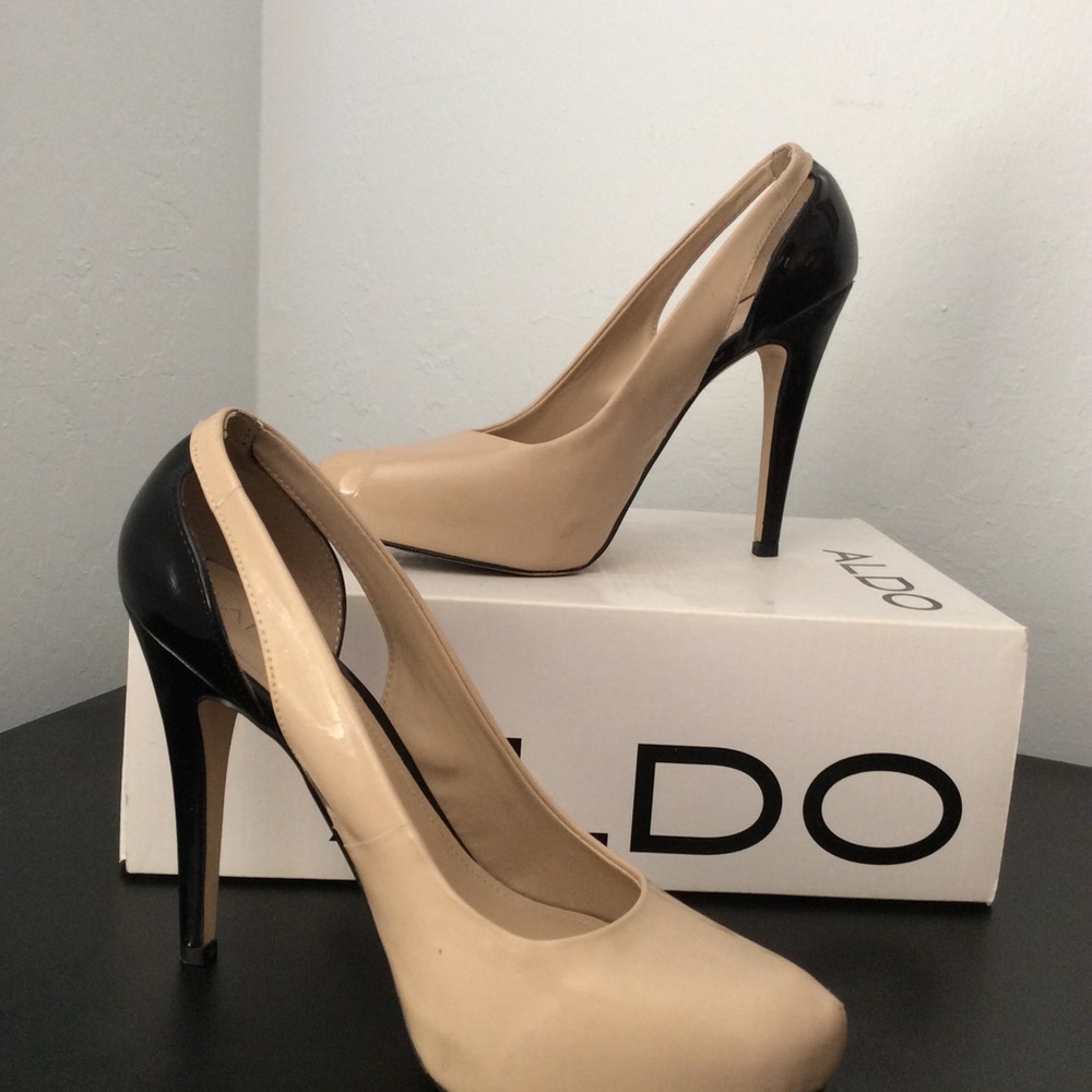 Beige and black platform pumps